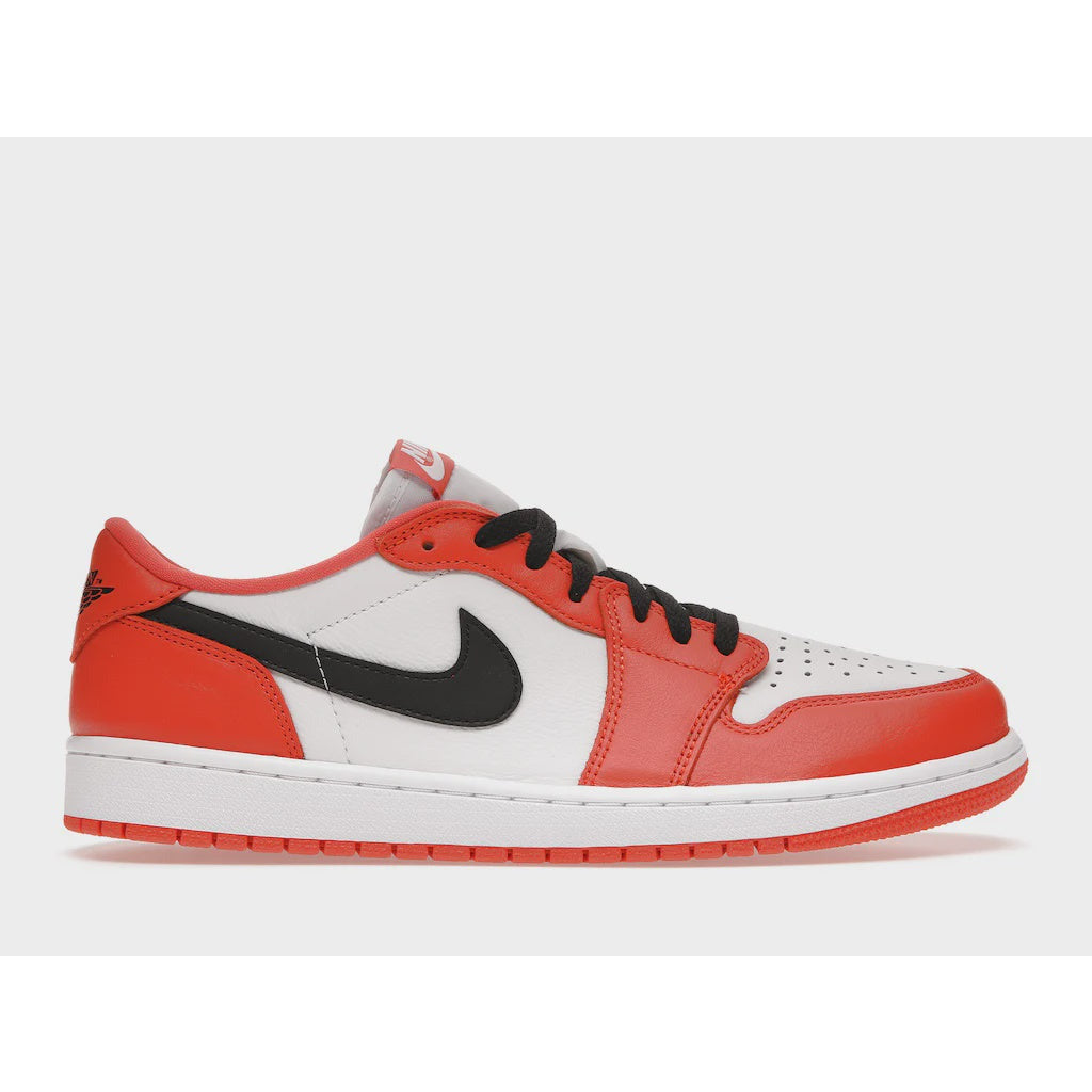 Orange and white Jordan 1 Low sneakers, known as Starfish (CZ0790-801), on a street