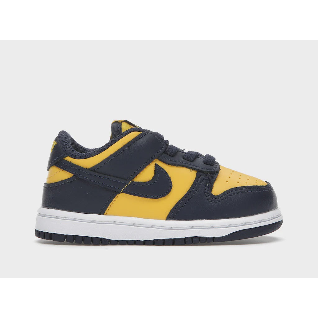 Close-up of the Nike Dunk Low Michigan (TD) (2021) toddler shoes in vibrant yellow and navy blue colorway with white detailing, perfect for stylish and comfortable everyday wear for little ones