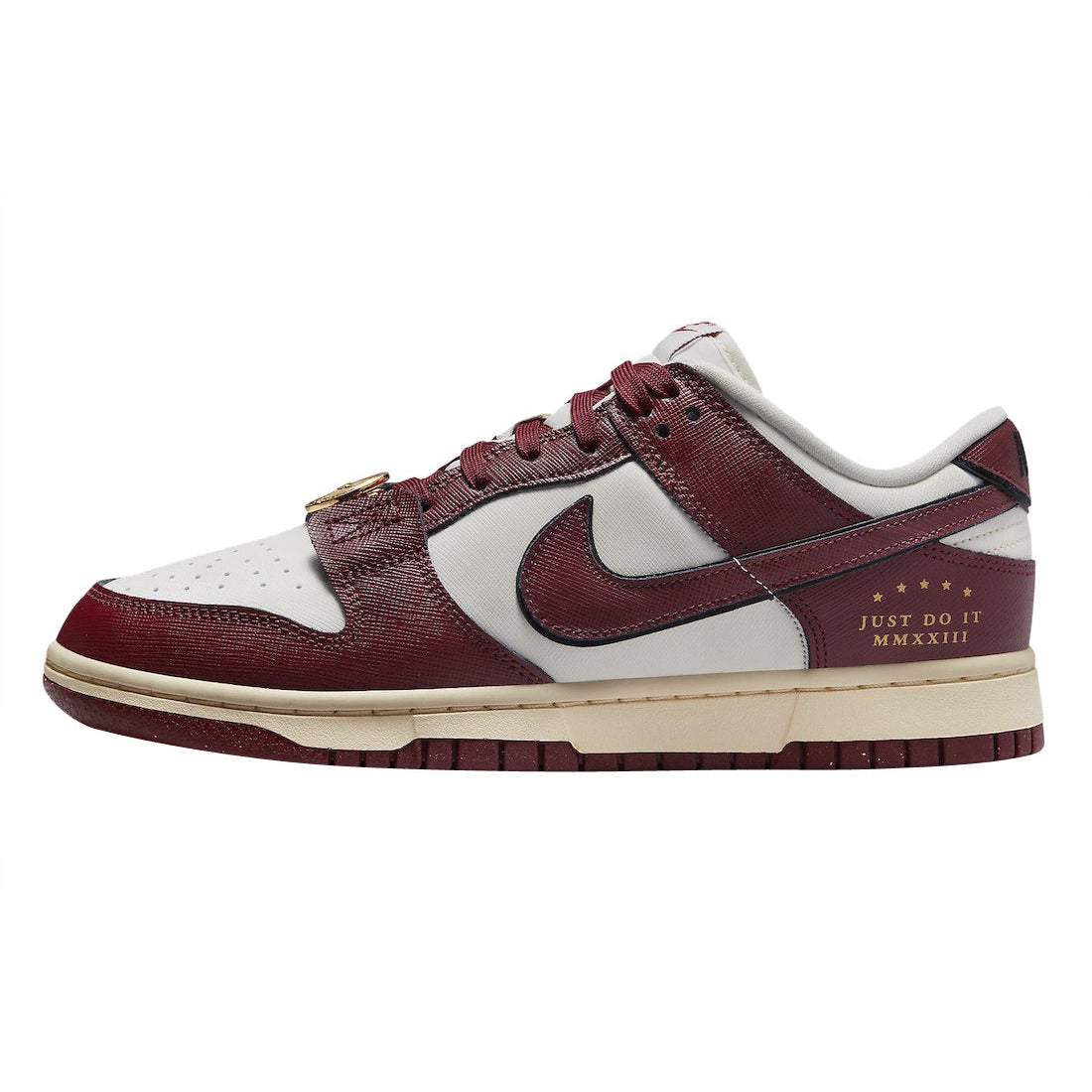 A close-up image of the Nike Dunk Low SE in Sail Team Red colorway, featuring the iconic Just Do It branding on the side panel and a classic white and red color scheme