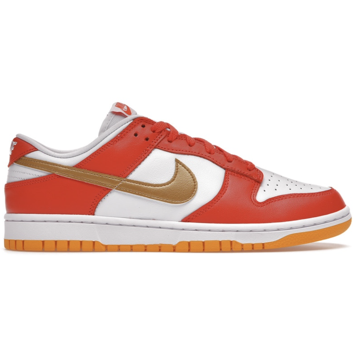A pair of Nike Dunk Low University Gold (W) sneakers, featuring a bright gold and white colorway with the signature Nike swoosh logo on the side
