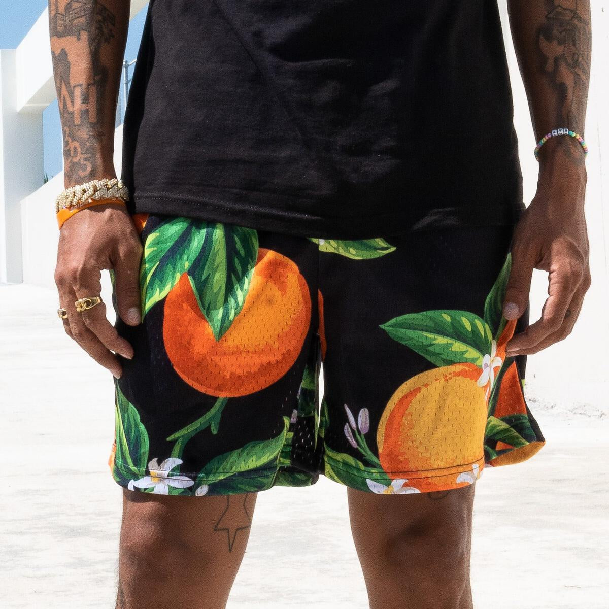 A close-up image of The Edition Brand ORANGES SHORT- Black showcasing the stylish and comfortable design with a focus on the black color and intricate details