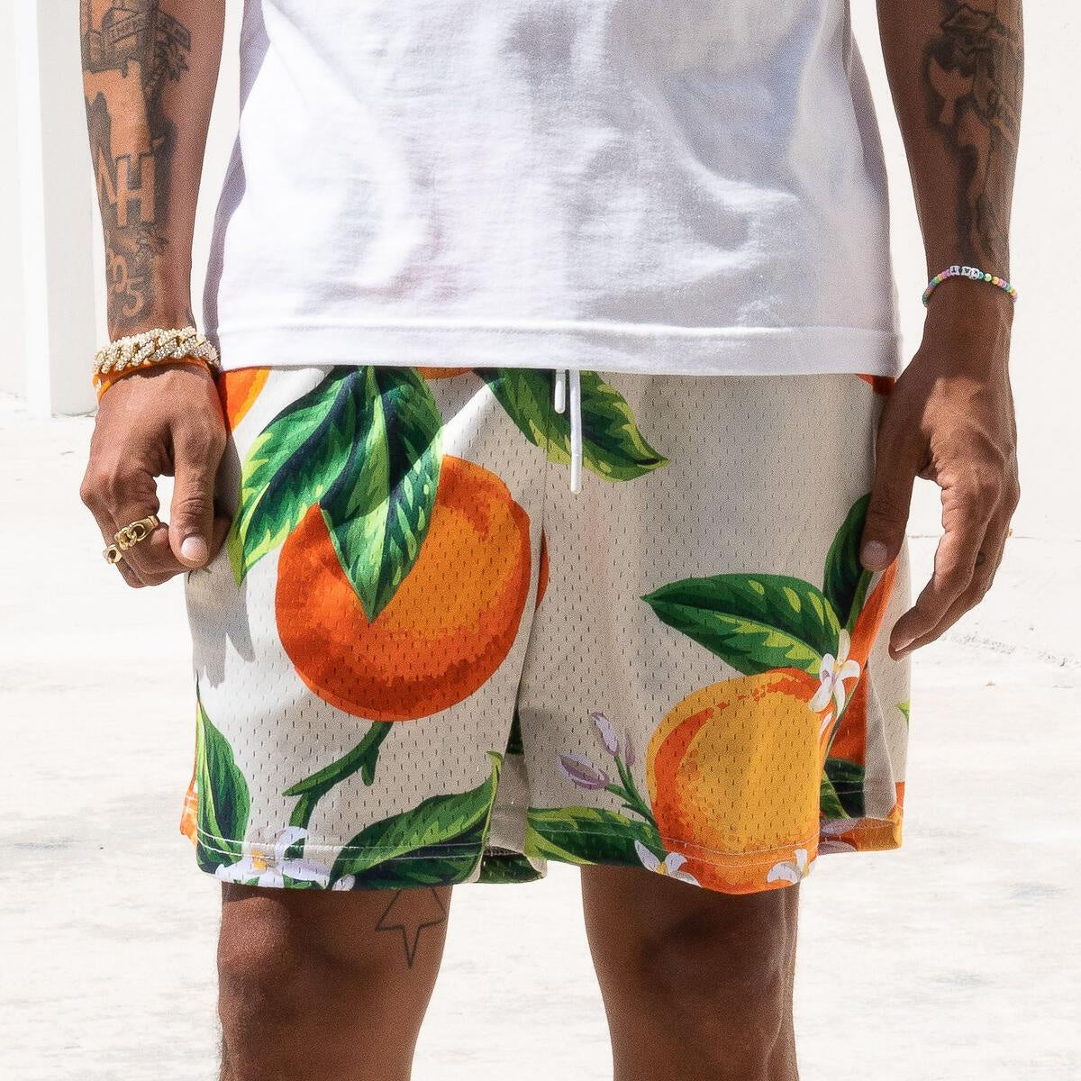 High-quality tan shorts with a stylish oranges pattern from The Edition Brand