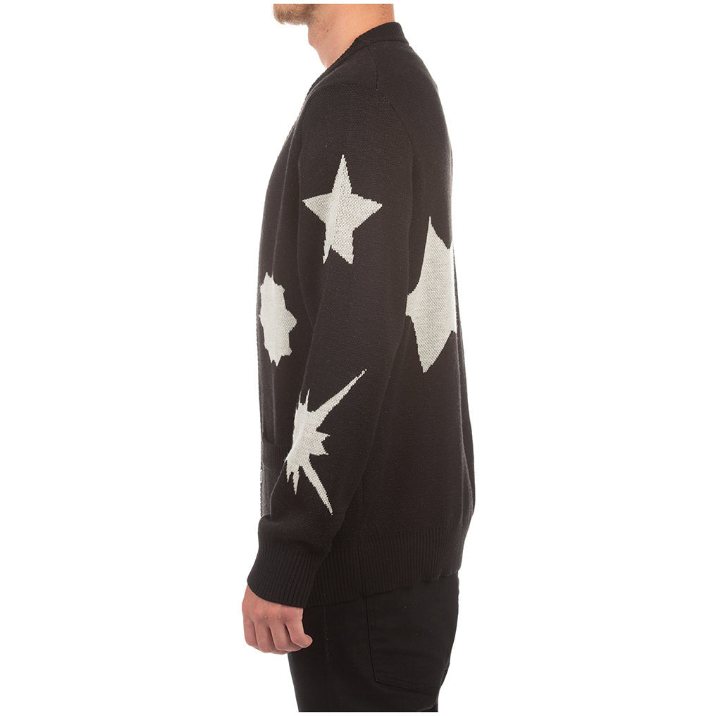 Close-up of the BBC Black BB Stargaze Sweater Vest (821-8504) logo and intricate knit pattern on a dark background