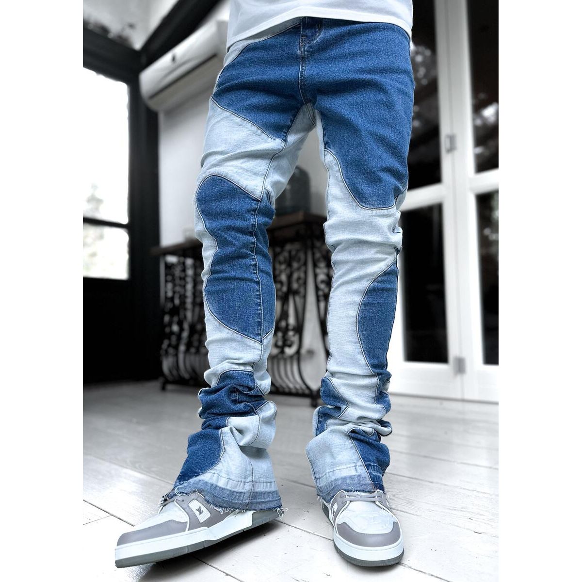 Vintage blue wavy denim jeans with distressed detailing and a retro feel