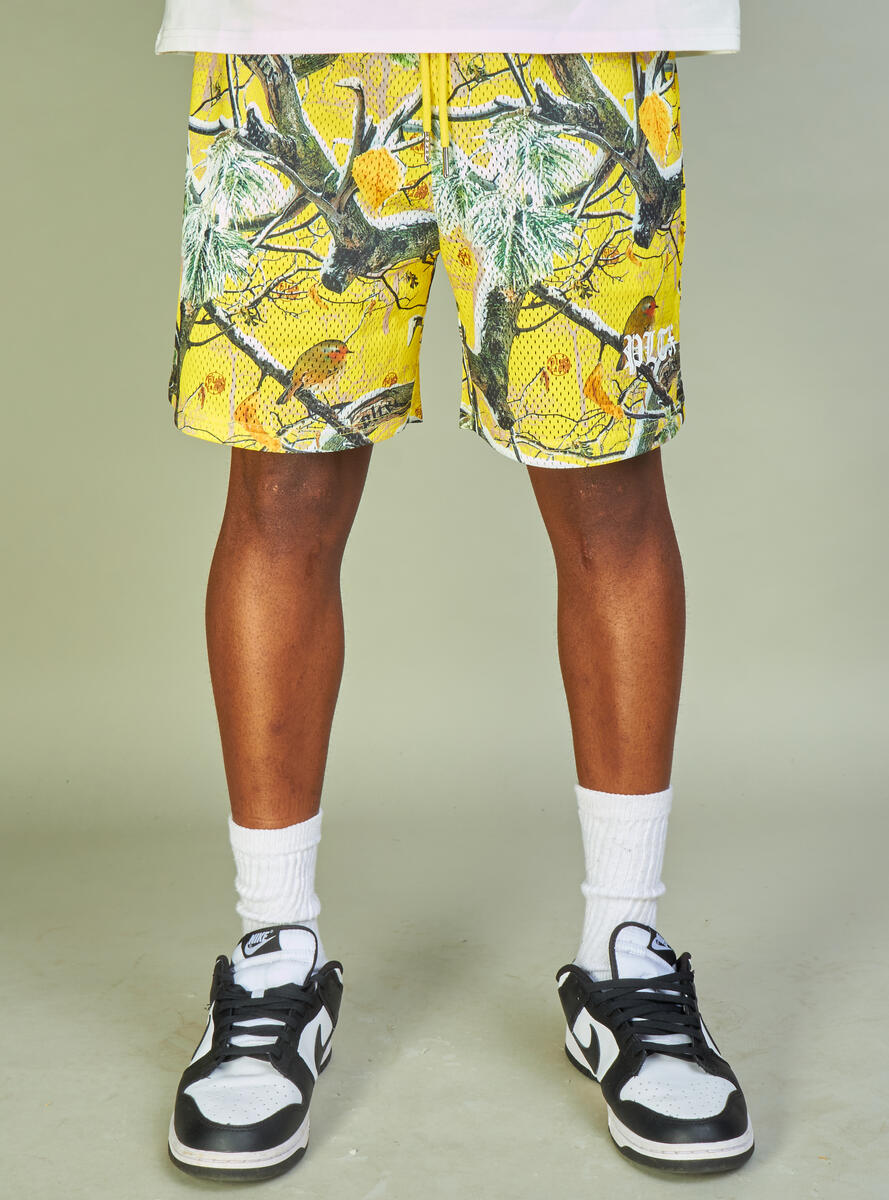  Bright yellow shorts featuring a unique 'Branches' pattern, great for political demonstrations