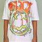 White/Orange Politics PLTX Graphic Tee with bold typography and vibrant colors