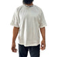 Close-up of the white Faith+Figures Faith+ Jumbo SS Tee showcasing the high-quality fabric and detailed logo design