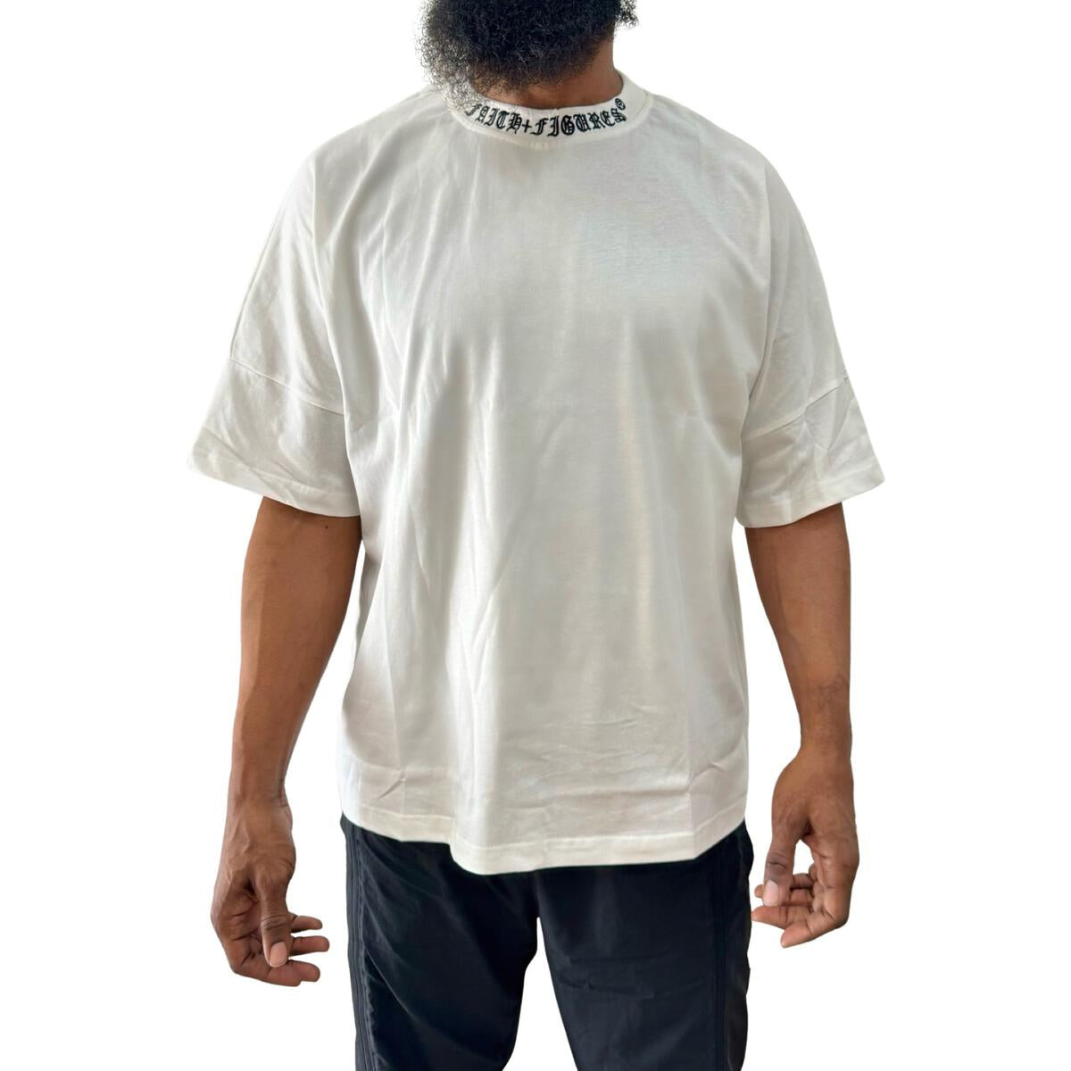 Close-up of the white Faith+Figures Faith+ Jumbo SS Tee showcasing the high-quality fabric and detailed logo design