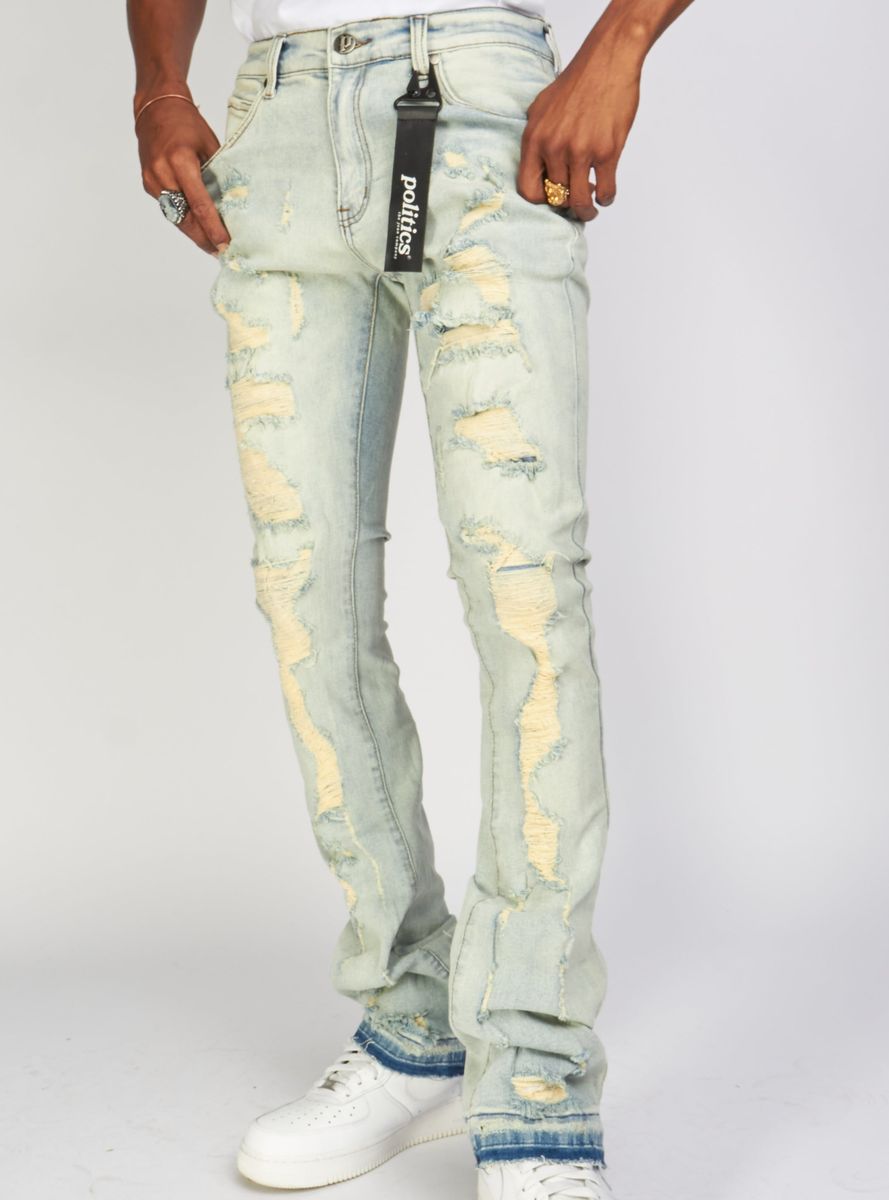 Light vintage blue distressed denim jeans with stacked silhouette and Uzi505 design