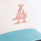 Close up of cream, teal, and pink Paradise LA Snapback Hat with embroidered logo on the front and adjustable strap at the back