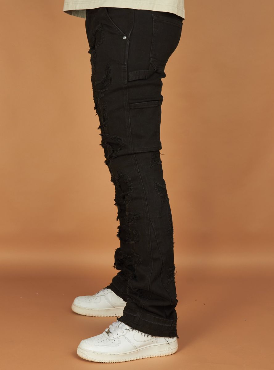 Side view of Politics Jeans Wagner Black Denim showcasing the tapered leg and button fly