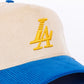 Close-up view of the cream, blue, and yellow Paradise LA Corduroy Snapback Hat with embroidered logo on the front and adjustable snapback closure 