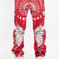 Close-up of Guapi Blood Red Tapestry Pants with intricate pattern and vibrant colors