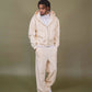 Cream fleece pants featuring waist pockets and back pocket