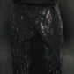 Black denim jeans with rhinestone embellishments for a fierce look
