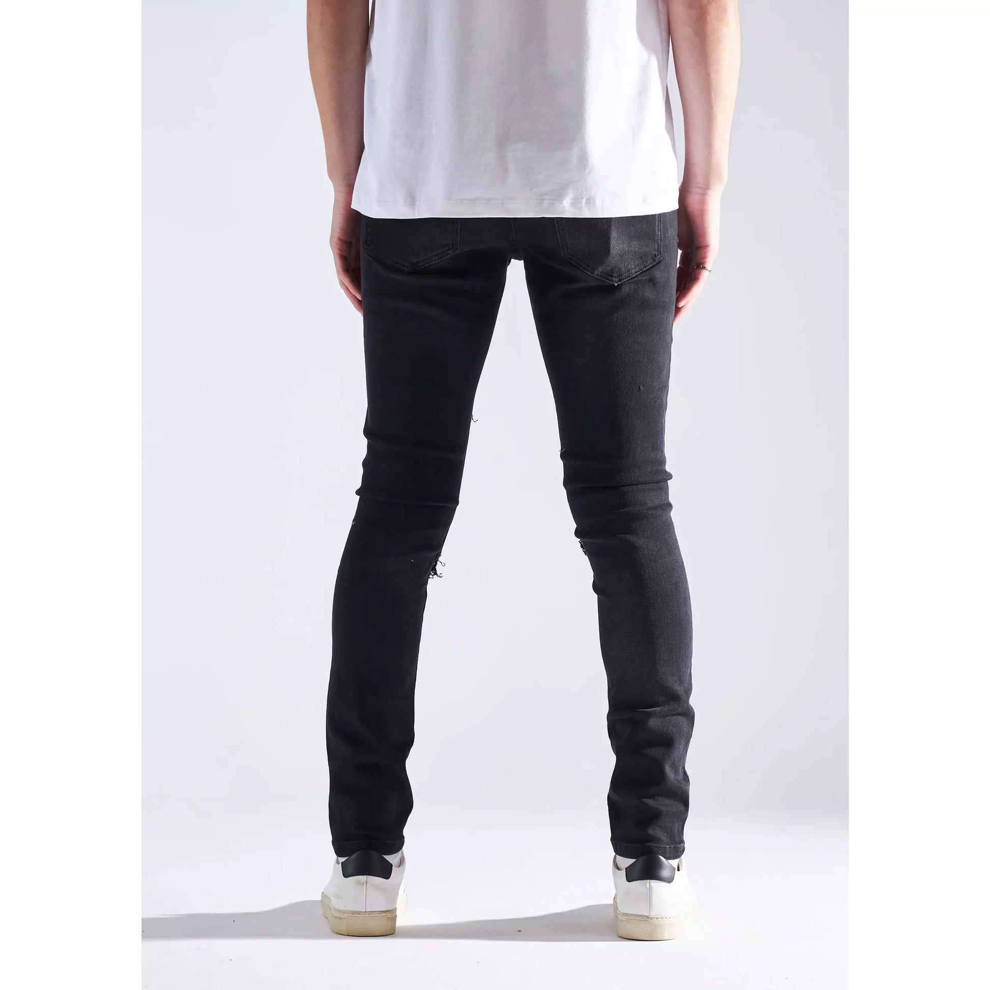 Embellish Oden Ripped Black Denim Jeans side view on model