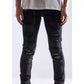 Embellish Oden Ripped Black Denim Jeans with white sneakers