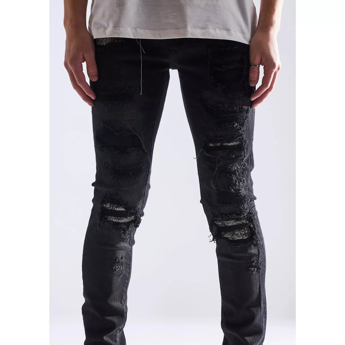 Embellish Oden Ripped Black Denim Jeans with white sneakers