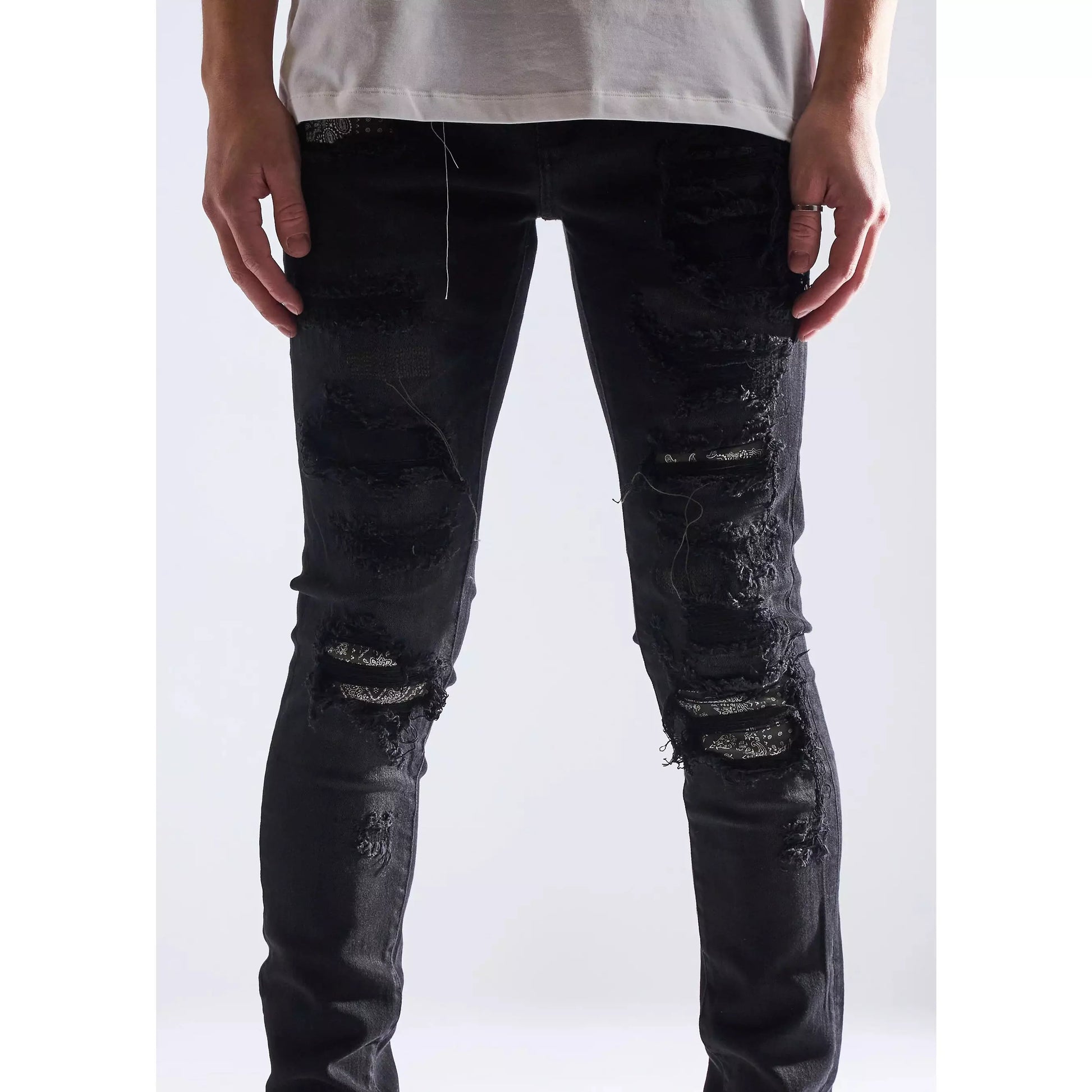 Embellish Oden Ripped Black Denim Jeans with white sneakers