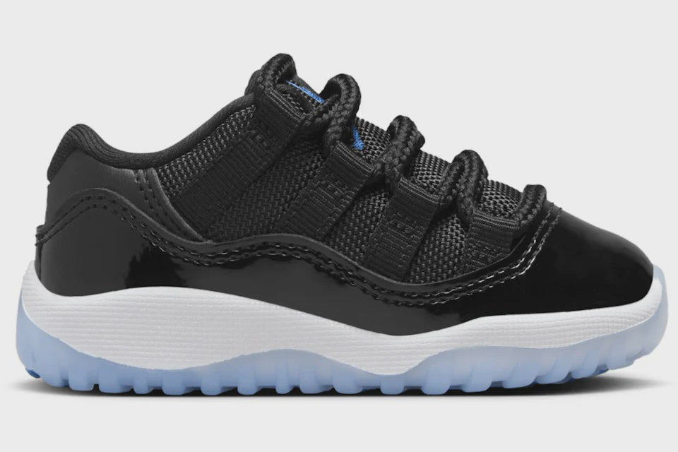 Black and white toddler-sized Jordan 11 Retro Low Space Jam sneakers