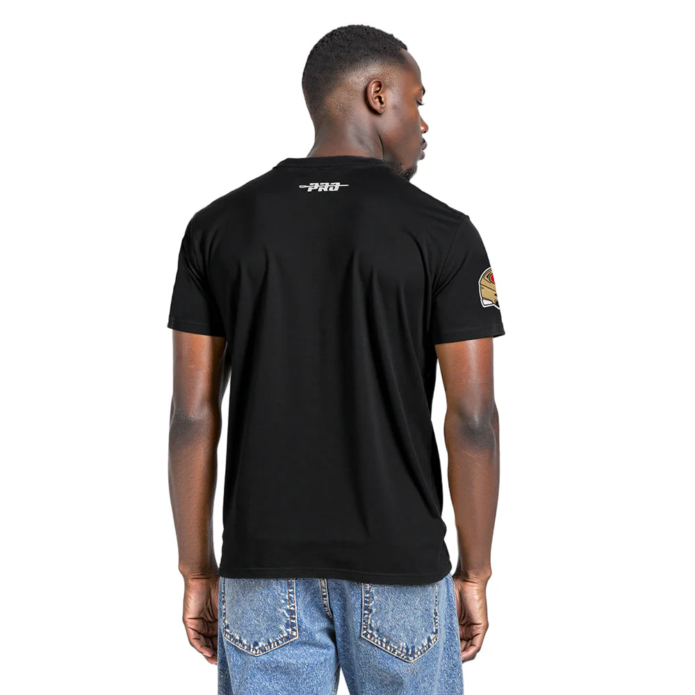 Close-up of Pro Standard San Francisco 49ers logo badge on black team tee shirt for sports enthusiasts