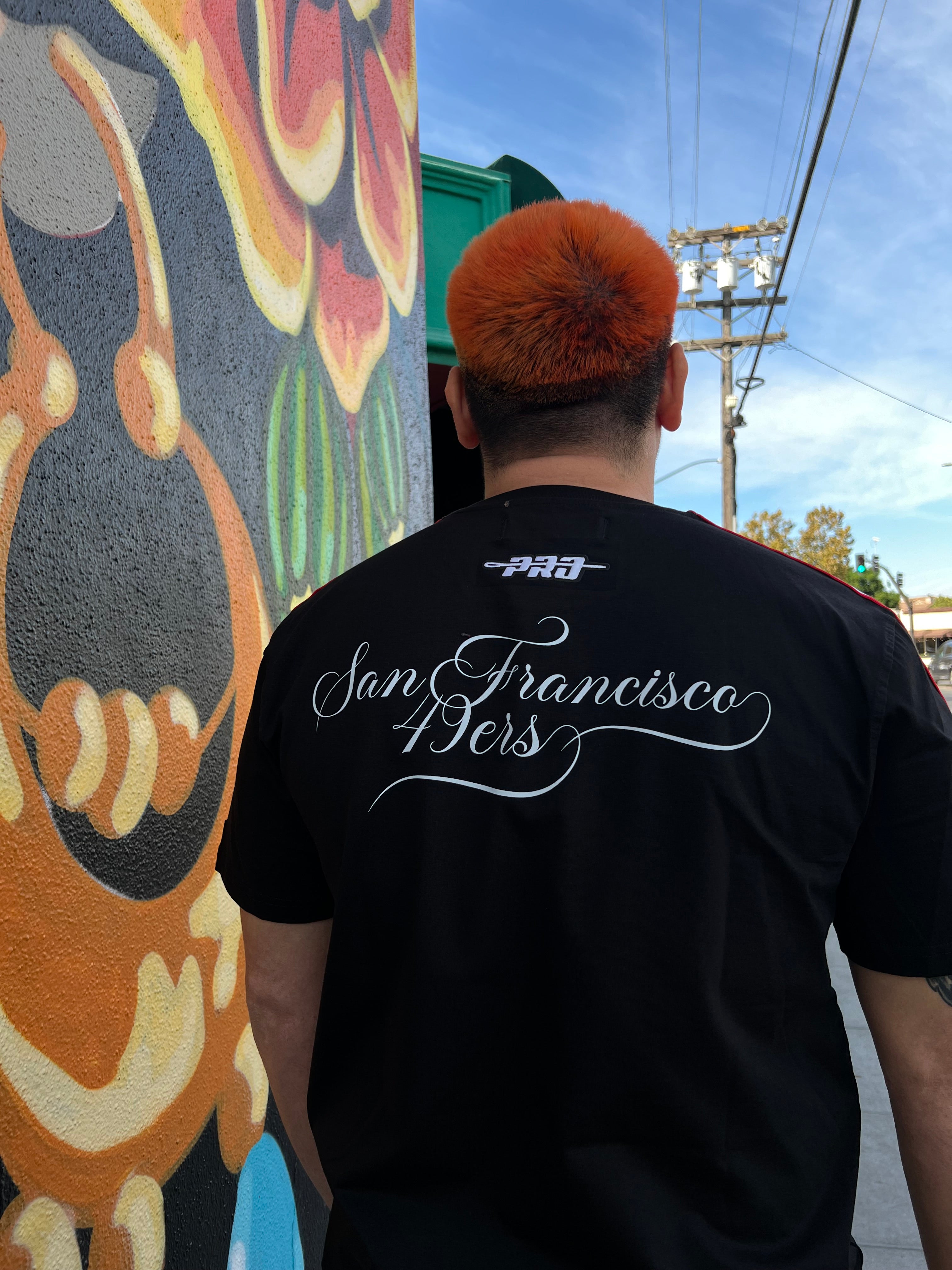 Black and red striped tee with San Francisco 49ers sugar skull logo