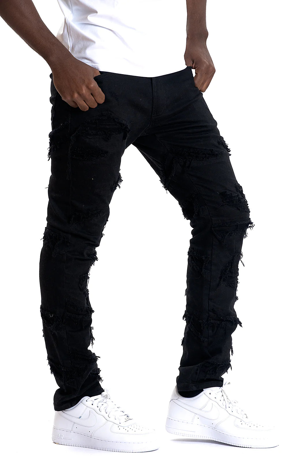 Model wearing Makobi Lombardi Jet Black Denim Jeans with stylish streetwear outfit