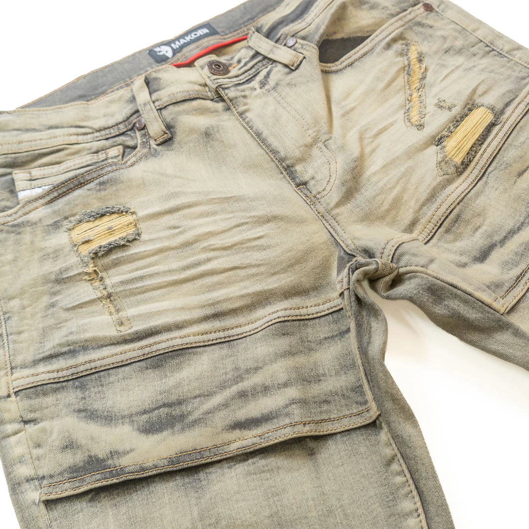 Side angle of Makobi Bruno M1965 jeans focusing on ripped design and classic denim style
