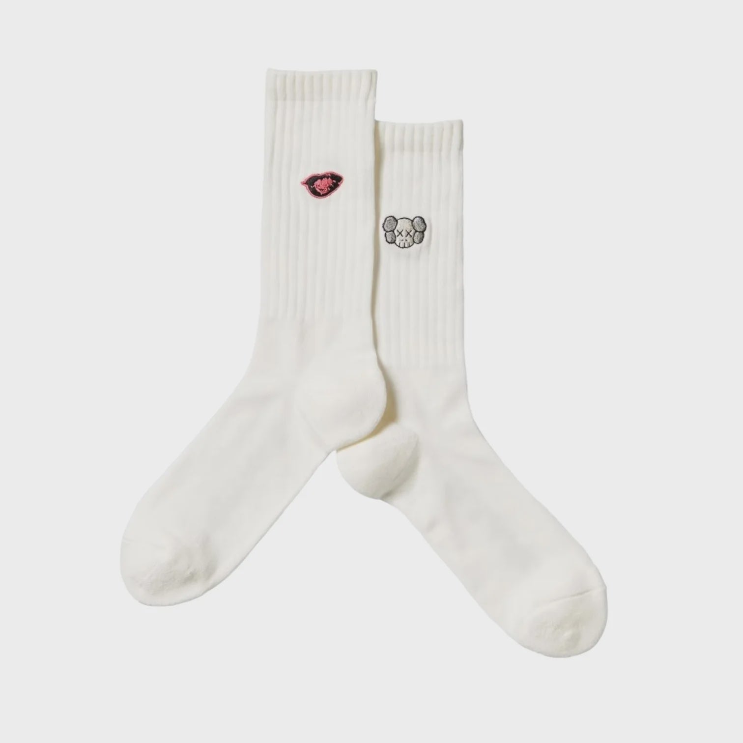 White socks featuring KAWS and Warhol collaborative artwork design, stylish and collectible