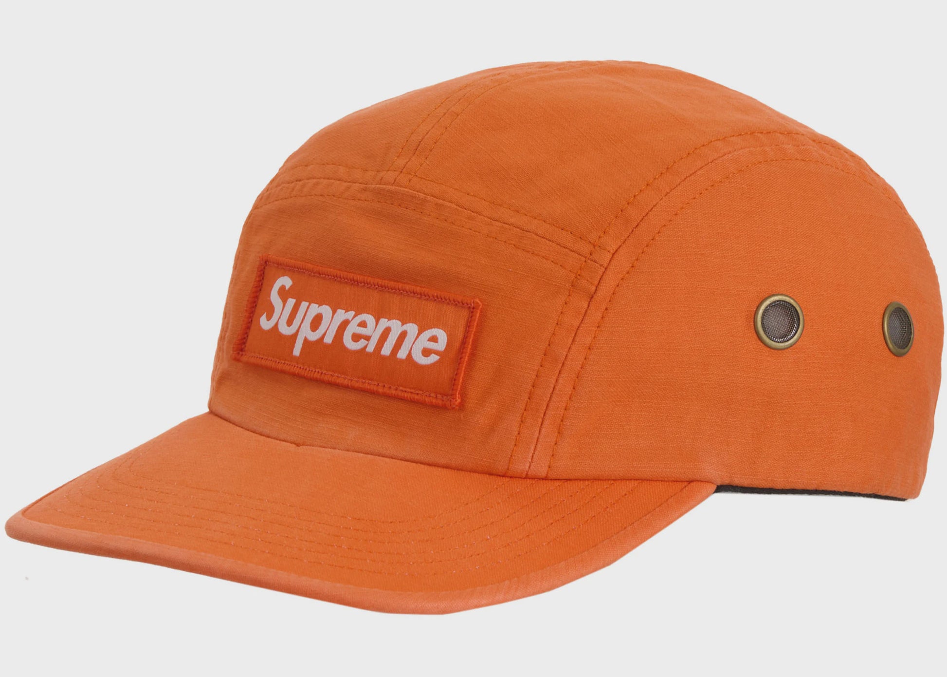 Orange Supreme Military Camp Cap from SS24 collection, a stylish and durable accessory for outdoor activities