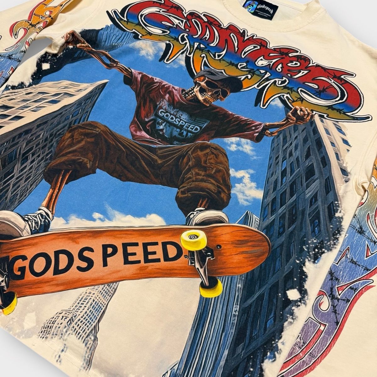Close-up of the Godspeed Ollie Long Sleeve in Bone showcasing the 10oz washed fabric and detailed art print