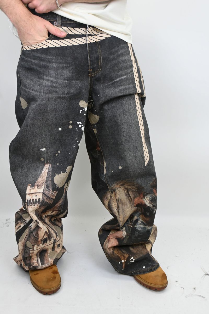 Close-up of Amor Jeans RM203B digital print black baggy jeans highlighting detailed fabric and length