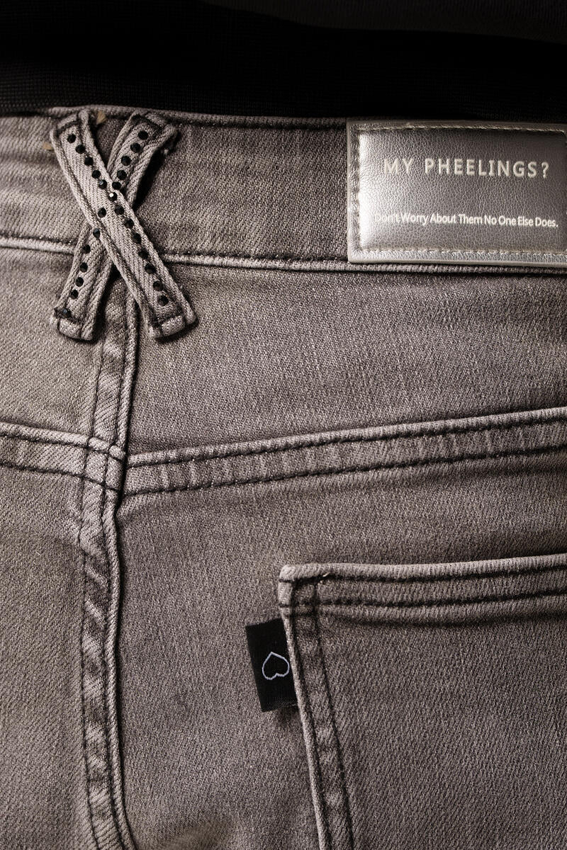 Side view of PHEELINGS Rising Above Charcoal Grey Flare Stack Denim showcasing the flattering flare silhouette and comfortable fit