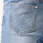 Pair of Guapi Pacific Blue Basics Stacked Denim laid out with other clothing items for a stylish outfit combination