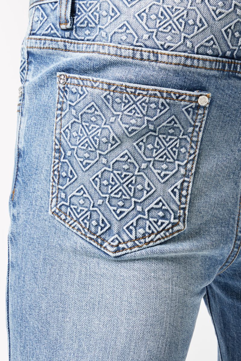 Pair of Guapi Pacific Blue Basics Stacked Denim laid out with other clothing items for a stylish outfit combination