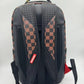 Close-up of the stylish Sprayground Money Grump Backpack featuring vibrant colors, detailed stitching, and spacious compartments suitable for everyday use