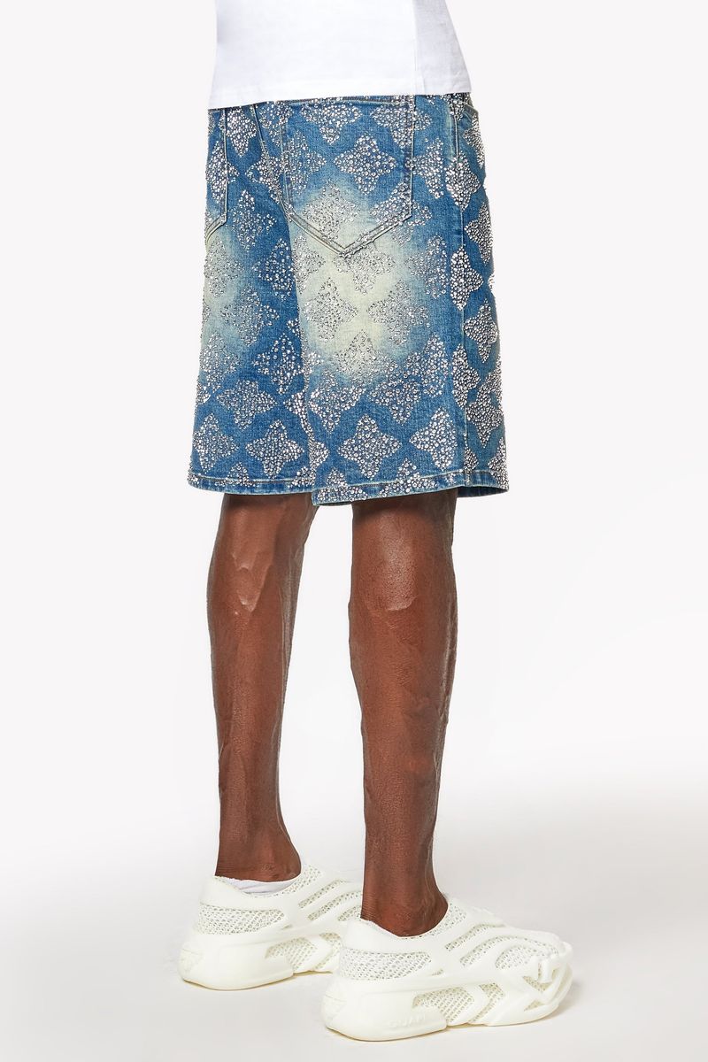Front view of classic blue wash denim shorts adorned with all-over embellishments for a luxe look