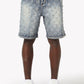 Close-up of shimmering rhinestone embellishments creating a sparkling diamond pattern on aqua blue denim shorts