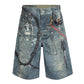 Blue denim shorts with a relaxed fit, all-over graphic print, heavyweight denim, and sand blast wash finish
