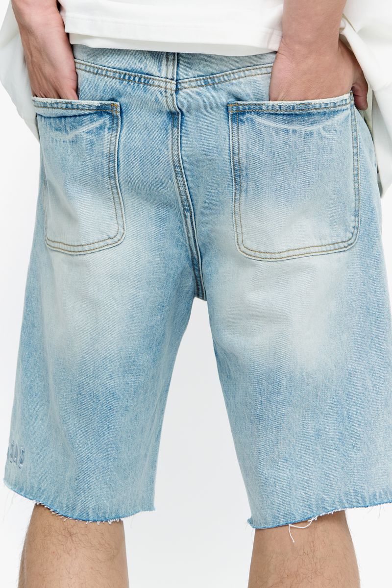 Detail of the distressed areas and fading effects on Valabasas Mr Shorts light blue denim shorts