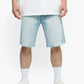 Full-length shot of Valabasas Mr Shorts in light blue wash denim laid flat on a surface