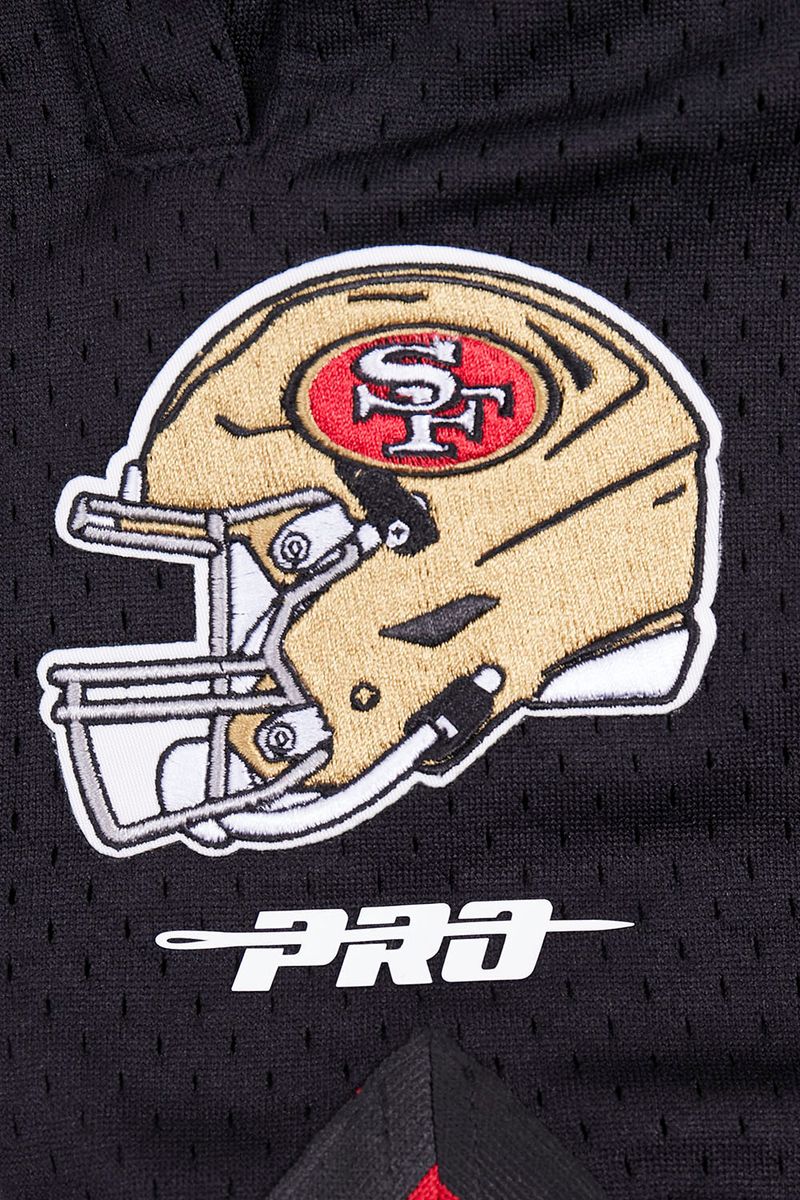 Detailed image of fabric and stitching on Pro Standard San Francisco 49ers athletic shorts in red and black