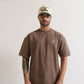 Close-up of PURE Monclair Brown Tee highlighting 100% cotton fabric and textured surface