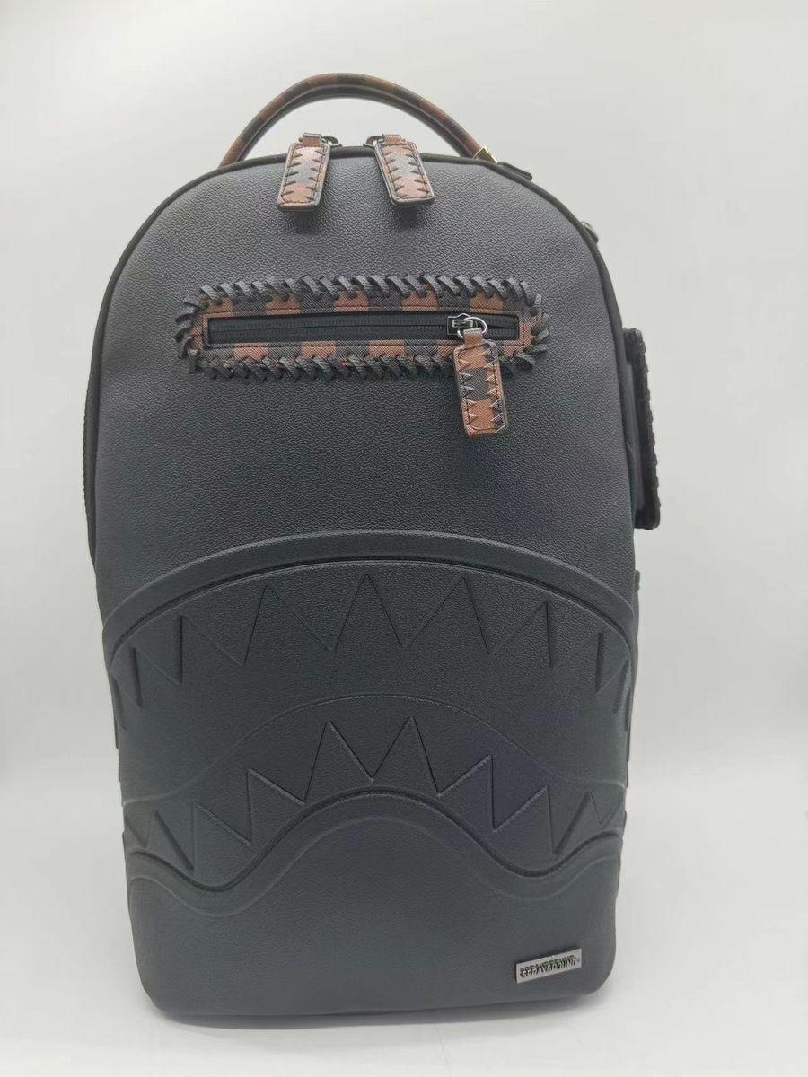 Front view of Sprayground Dose Of Check Deux DLXS Backpack showcasing dimensions and design