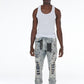 Stylish and trendy light blue Stacked Flare Ripped Jeans with paint splatter