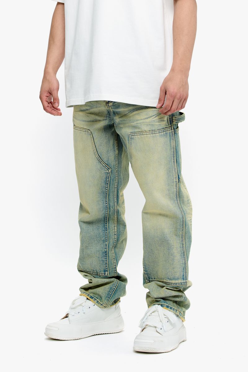 Rear view of the jeans highlighting the rear pockets and overall vintage wash look
