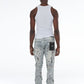 Stylo Stacked Flare Ripped Jeans featuring edgy paint splatter design