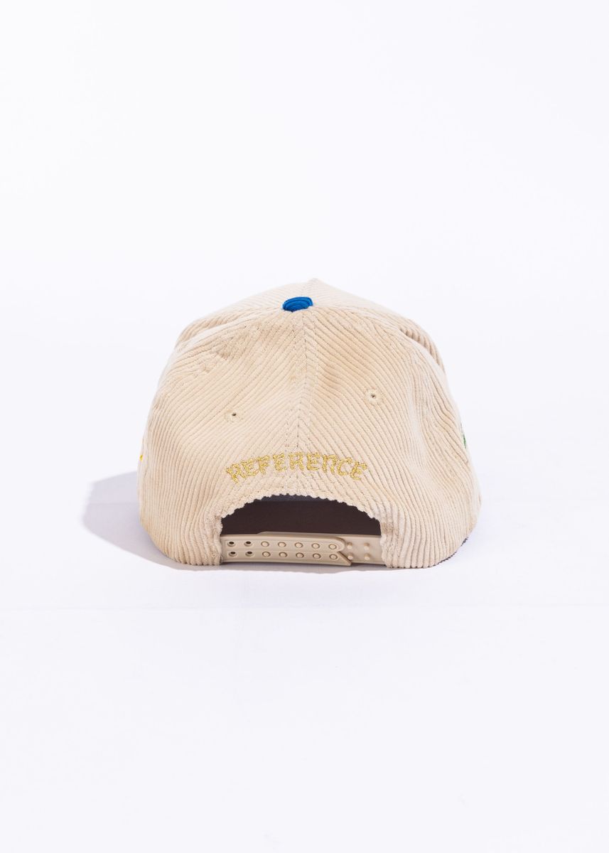  Stylish Paradise LA Corduroy Snapback Hat in cream, blue, and yellow colorway featuring a flat brim and soft, textured corduroy fabric