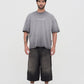 Close-up of the neckline and stitching details of the PURE Áurea Grey Wash Oversized Tee made from 100% cotton
