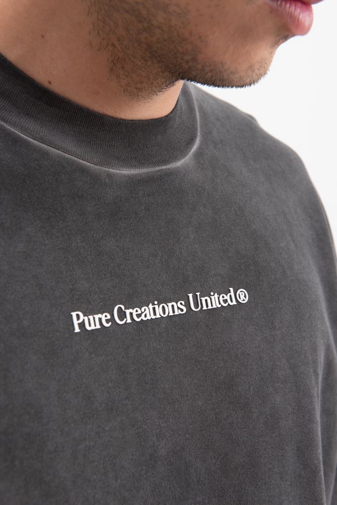 Close-up of the black fabric showing the 350 gr weight and smooth texture of the PURE Knockout Fight Black Tee